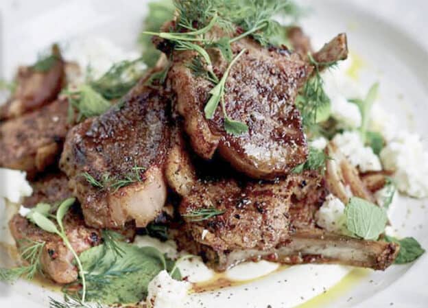 Picture of grilled rib lamb chops with feta and dates.